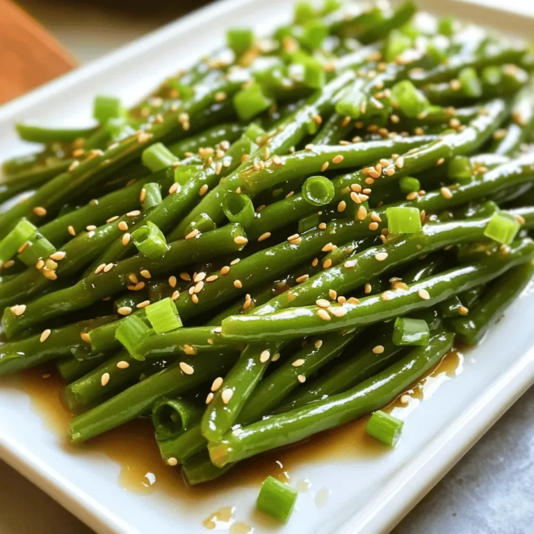 For the sesame soy glazed green beans, you will need: - 1 lb fresh green beans, trimmed and washed - 3 tablespoons soy sauce (low-sodium recommended) - 1 tablespoon sesame oil (for a rich, nutty flavor) - 1 tablespoon honey or maple syrup (for a touch of sweetness) - 2 cloves garlic, finely minced - 1 teaspoon fresh ginger, freshly grated - 1 tablespoon sesame seeds, preferably toasted for enhanced flavor - 1 tablespoon vegetable oil (for sautéing) - Salt and freshly ground black pepper, to taste - 2 green onions, thinly sliced (for a fresh garnish) You can switch things up with these alternatives: - Use tamari instead of soy sauce for a gluten-free option. - Swap honey for agave syrup for a vegan choice. - For more heat, add red pepper flakes or sriracha to the sauce. - If you want a different flavor, try using olive oil or canola oil instead of vegetable oil. This dish is not only tasty but also nutritious. Here are some quick facts: - Calories: Approximately 120 per serving - Protein: 3 grams - Carbohydrates: 12 grams - Dietary Fiber: 4 grams - Sugars: 3 grams - Fat: 7 grams - Sodium: 400 mg (if using low-sodium soy sauce) This recipe is perfect for a healthy side dish. It brings together fresh green beans and a savory glaze. Enjoy the blend of flavors and the colorful presentation. You can find the full recipe with detailed instructions to make this dish shine! Start with 1 pound of fresh green beans. Rinse them well under cold water. Remove the ends to make them neat. This step helps the beans cook evenly and look great on the plate. In a small bowl, mix together the following ingredients: - 3 tablespoons soy sauce - 1 tablespoon sesame oil - 1 tablespoon honey or maple syrup - 2 cloves garlic, minced - 1 teaspoon fresh ginger, grated Whisk these ingredients until they blend well. This sauce will add rich flavor to the beans. Heat 1 tablespoon of vegetable oil in a large skillet over medium-high heat. When the oil shimmers, add the green beans. Stir-fry them for 5 to 7 minutes. You want them bright green and tender but still crisp. Next, pour the sauce over the beans. Toss them to coat each piece well. Lower the heat to medium and cook for 2 to 3 more minutes. This step allows the sauce to thicken and cling to the beans. Remove the skillet from heat. Then, sprinkle 1 tablespoon of toasted sesame seeds on top. Give it a gentle toss to mix. Season with salt and black pepper to taste. Serve your sesame soy glazed green beans on a white platter. Add thinly sliced green onions for a lovely garnish. Enjoy your colorful and tasty side dish! For the full recipe, feel free to check the details above. To get the best glaze, use low-sodium soy sauce. This choice helps balance flavors. Combine it with sesame oil for that rich, nutty taste. Honey or maple syrup adds a sweet touch. You can also adjust the sweetness to suit your taste. For a thicker glaze, let the sauce cook longer. This helps it stick well to the green beans. Adding fresh ginger and garlic makes a big difference. They bring warmth and depth to the dish. Consider tossing in crushed red pepper for some heat. If you want a citrus twist, a splash of lemon juice works wonders. Try adding a sprinkle of chopped peanuts for crunch. These small changes boost your dish’s flavor profile significantly. Fresh green beans need proper care. Start by washing them well. Trim the ends to keep them tidy. Stir-frying is the best method for cooking. Heat your skillet until it shimmers. This keeps the beans vibrant and crisp. Don't overcrowd the pan; it can lead to steaming instead of frying. Stir them often to ensure even cooking. Aim for a bright green color and tender texture. This maximizes both taste and nutrients. {{image_4}} You can make sesame soy glazed green beans heartier by adding proteins. Try adding cooked chicken, shrimp, or tofu. They add flavor and nutrients. Just cook your protein separately and toss it in during the last few minutes of cooking. This makes a complete meal! Switching up the sauce can change the whole dish. Instead of soy sauce, you might use tamari for a gluten-free option. You can also try teriyaki or hoisin sauce for a sweeter touch. Mixing in sriracha or chili paste gives it a spicy kick. The options are endless! To adjust the spice level, add crushed red pepper flakes for heat. Use just a pinch if you want a gentle warmth. For more spice, add more. You can also toss in fresh sliced peppers during the stir-fry. This gives your dish a vibrant look and a good kick! Explore the full recipe for sesame soy glazed green beans to see how these variations can work perfectly! You can store sesame soy glazed green beans in the fridge. Place them in an airtight container. They will stay fresh for up to three days. Avoid leaving them out for too long, as this can spoil the flavor. You can freeze these green beans for later use. First, let them cool completely. Then, place them in a freezer-safe bag. Make sure to remove as much air as possible. These beans will last for up to two months in the freezer. To keep their taste and texture, try to freeze them as soon as possible. Reheating sesame soy glazed green beans is simple. For the best results, use a skillet. Heat a little oil over medium heat. Then, add the beans and stir until they are warm. You can also use a microwave. Place the beans in a microwave-safe dish. Cover it and heat in short bursts, stirring in between. This will help keep them crisp and tasty. You can store sesame soy glazed green beans in the fridge for up to three days. After cooking, let them cool down. Keep them in an airtight container to maintain freshness. Reheat them gently before serving to enjoy their flavor again. Yes, you can easily make this dish vegan! Simply replace honey with maple syrup. Use low-sodium soy sauce as your base. This change keeps the dish sweet and flavorful. The sesame oil brings a nutty taste that adds depth without using animal products. Sesame soy glazed green beans pair well with many dishes. You can serve them alongside rice or quinoa for a wholesome meal. They also complement grilled chicken or tofu beautifully. For a full meal, add a fresh salad to balance the flavors. Try the Full Recipe for more details. We explored many aspects of making sesame soy glazed green beans. We covered essential ingredients and their alternatives. You learned how to prepare and cook the dish step by step. I shared tips to enhance flavors and perfect the glaze. We discussed variations, storage, and practical reheating methods. These green beans are simple yet delicious. With these tips, you can impress anyone at your next meal. Enjoy experimenting and making this dish your own!
