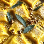 To make the pasta dough, you need: - 2 cups all-purpose flour - 3 large eggs - 1 teaspoon salt The flour is the base. It gives the dough structure. The eggs add richness and help bind the dough. Salt enhances flavor and helps with texture. For the delicious filling, gather: - 1 cup canned pumpkin puree - 1/2 cup ricotta cheese - 1/4 cup grated Parmesan cheese - 1 teaspoon ground nutmeg - 1/2 teaspoon black pepper Canned pumpkin makes it easy to get that sweet, earthy flavor. Ricotta adds creaminess, while Parmesan gives a nice sharp taste. Nutmeg and black pepper add warmth and depth to the filling. To create the brown butter sauce, you will need: - 1/2 cup unsalted butter - 10 fresh sage leaves - Extra Parmesan cheese for serving - Chopped walnuts (optional, for garnish) Unsalted butter is key for making brown butter. You want to control the salt level. Fresh sage gives an aromatic touch. Serve with extra Parmesan and walnuts for a crunch! To start, grab 2 cups of all-purpose flour. Create a mound on a clean surface. Make a well in the center. Crack in 2 large eggs and add 1 teaspoon of salt. With a fork, stir the eggs, slowly mixing in the flour. Keep mixing until a shaggy dough forms. Transfer this dough to a floured surface. Knead it for 8 to 10 minutes until smooth. Wrap the dough in plastic wrap. Let it rest for 30 minutes. This step helps the gluten relax for easy rolling. In a bowl, mix 1 cup of canned pumpkin puree, 1/2 cup of ricotta cheese, and 1/4 cup of grated Parmesan cheese. Add 1 teaspoon of ground nutmeg and 1/2 teaspoon of black pepper. Stir well until smooth. Taste the filling and adjust the spices as needed. This filling brings warmth and flavor to the ravioli. After resting, divide the dough into four equal pieces. Roll each piece thin with a pasta machine or rolling pin. Aim for a thickness of about 1/16 inch. Lay one sheet of pasta flat. Place a teaspoon of filling every 2 inches apart. Use a brush to wet the area around each mound. Lay another sheet of pasta on top. Press down gently to seal. Cut into squares using a sharp knife or pizza cutter. Repeat with the rest of the dough and filling. Bring a large pot of salted water to a gentle boil. Carefully drop the ravioli into the pot. Cook them for 4 to 5 minutes. They are done when they float to the top. Use a slotted spoon to remove them. Transfer the ravioli to a colander to drain. In a skillet over medium heat, melt 1/2 cup of unsalted butter. When it bubbles, add 10 fresh sage leaves. Stir often, browning the butter slightly. Let the sage crisp without burning. This sauce adds a nutty flavor that pairs well with the ravioli. Once the ravioli are cooked, transfer them to the skillet with the brown butter sauce. Gently toss the ravioli, coating them well. Plate the ravioli and sprinkle with more grated Parmesan cheese. For extra crunch, add chopped walnuts if you like. Serve this dish in shallow bowls, drizzling more sauce on top. Enjoy your delicious pumpkin sage brown butter ravioli! To achieve perfect pasta, use good flour. I recommend all-purpose flour for its balance. Knead the dough well. This builds gluten, helping the pasta hold its shape. Let it rest before rolling. This relaxes the gluten, making it easier to work with. Roll the dough thin, but not too thin. Aim for about 1/16 inch to get the right bite. For a richer filling, taste as you mix. You can add a pinch of cinnamon for warmth. A dash of maple syrup can enhance the sweetness. If you want it savory, try adding garlic powder or sautéed onions. Fresh herbs can also boost the flavor. Experiment until you find the blend you love. Serve the ravioli in shallow bowls. Drizzle extra brown butter sauce over the top. Add a generous sprinkle of grated Parmesan cheese. For crunch, top with chopped walnuts. Fresh sage leaves make a lovely garnish. Pair this dish with a light salad or roasted veggies. A crisp white wine also complements the flavors well. Enjoy your meal! {{image_4}} You can change the filling for fun flavors. Try using sweet potato instead of pumpkin. It brings a creamy texture and a mild sweetness. Another option is spinach with ricotta. This mix gives a fresh taste and a nice color. For a savory twist, use mushrooms and goat cheese. This combo adds earthiness and depth. You can explore different sauces to pair with your ravioli. A simple garlic butter sauce adds rich flavor. Just melt butter and sauté minced garlic until golden. You can also try a creamy Alfredo sauce. It brings a smooth texture that coats the ravioli well. For a fresh touch, use a light tomato sauce. It balances the richness of the filling perfectly. If you need gluten-free options, use rice flour for the dough. It creates a nice texture without gluten. For the filling, you can blend pumpkin with silken tofu. This makes a creamy and vegan-friendly filling. You can also try using cashew cheese instead of ricotta for a nutty flavor. This keeps your dish plant-based and tasty. You can keep cooked ravioli in the fridge. Place them in an airtight container. They will stay fresh for about three days. If you want to avoid sogginess, do not mix them with sauce. Store the sauce separately. Freezing uncooked ravioli is a great way to save some for later. First, lay them out on a baking sheet. Make sure they do not touch each other. Freeze them for about 30 minutes until firm. Then, transfer them to a freezer bag. They will keep well for up to two months. Reheating leftovers is simple. You can use a microwave or stovetop. If you use a microwave, heat them for about one minute. Check and stir to ensure even heating. For the stovetop, add a splash of water in a pan and cover it. Heat on low until warm, usually about five minutes. Enjoy your ravioli hot! Making Pumpkin Sage Brown Butter Ravioli takes about 45 minutes to prep and 15 minutes to cook. In total, you need around one hour. Yes, you can use store-bought pasta. It saves time and still tastes great. Look for fresh or frozen pasta for the best results. I suggest serving it with a simple side salad or garlic bread. Both add a nice touch to the meal. You can also pair it with roasted vegetables for extra flavor. Absolutely! You can prepare the ravioli a day in advance. Store them in the fridge and cook them just before serving. Yes, fresh pumpkin works well too! Just peel, cook, and puree it. This option offers a fresh taste, but it takes more time to prepare. In this blog post, we explored how to make delicious Pumpkin Sage Brown Butter Ravioli. We covered the main ingredients needed for dough, filling, and sauce. I provided step-by-step instructions, helpful tips, and variations to try. You also learned how to store and reheat ravioli for future meals. Cooking ravioli is fun and rewarding. With practice, you can impress friends and family with your tasty dishes. Enjoy making, serving, and savoring your homemade ravioli!