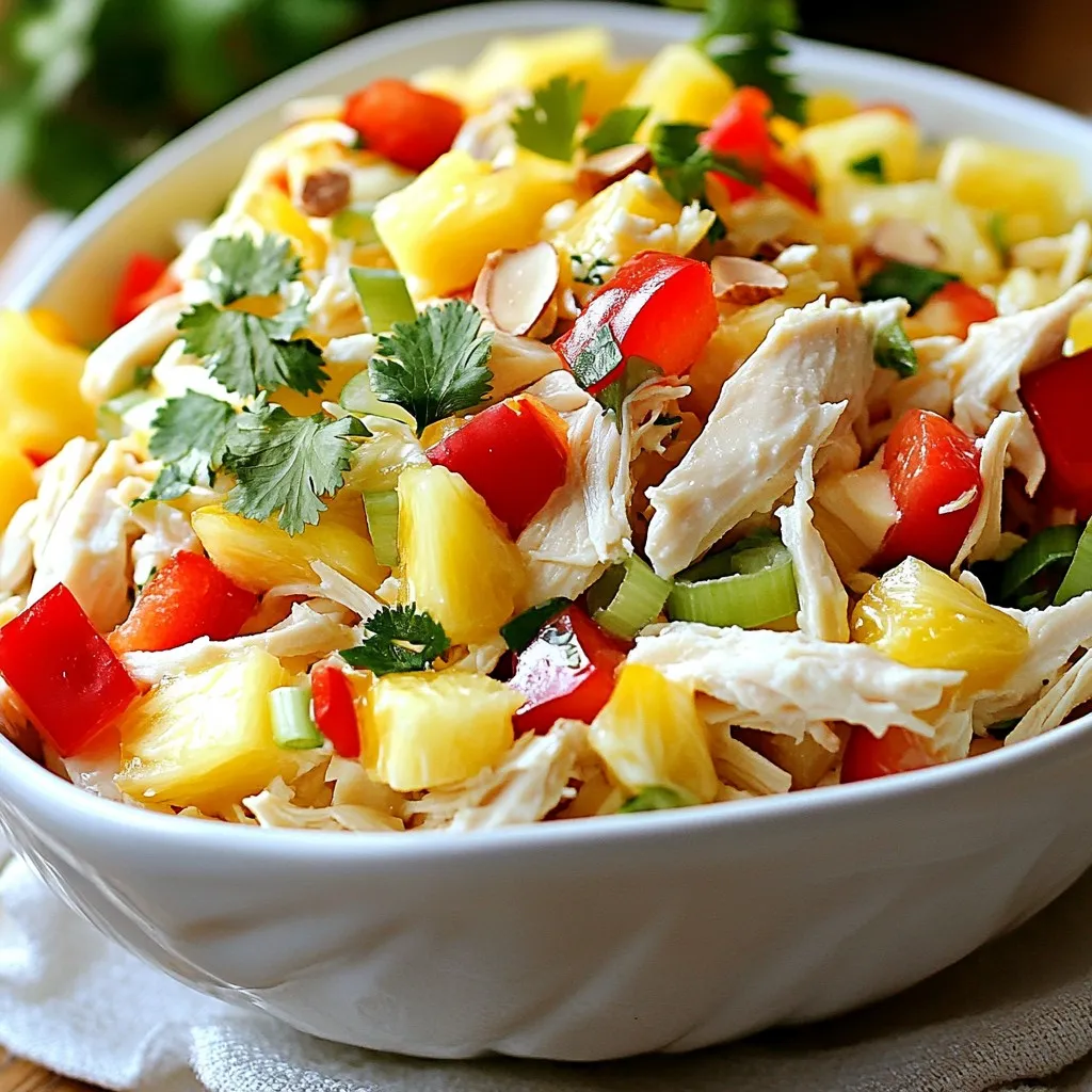 - 2 cups of cooked chicken, shredded - 1 cup of fresh pineapple, diced into small chunks - 1/2 cup of red bell pepper, finely chopped - 1/2 cup of celery, diced - 1/4 cup of green onions, thinly sliced - 1/2 cup of Greek yogurt (preferably plain) - 1/4 cup of mayonnaise - 1 tablespoon of fresh lime juice - 1 tablespoon of honey - Salt and black pepper to taste - 1/4 cup of slivered almonds (optional, for added crunch) - Fresh cilantro, chopped (optional, for garnish) You can swap cooked chicken for canned chicken or rotisserie chicken. If you want a vegan option, use chickpeas instead. Instead of Greek yogurt, try coconut yogurt for a dairy-free salad. You can replace mayonnaise with avocado for a creamier texture. If you do not have red bell pepper, yellow or orange peppers work well too. For a bit of sweetness, consider using mango in place of pineapple. This salad has about 300 calories per serving. It offers good protein from the chicken and healthy fats from the yogurt and mayonnaise. You also get vitamins from pineapple, red bell pepper, and celery. The slivered almonds add crunch and healthy fats. This dish is great for a light meal or a side at gatherings. {{ingredient_image_2}} First, get a large mixing bowl. Add 2 cups of cooked chicken, shredded. Next, toss in 1 cup of fresh pineapple, diced into small chunks. Then, add 1/2 cup of red bell pepper, finely chopped, and 1/2 cup of diced celery. Finish with 1/4 cup of thinly sliced green onions. Mix these ingredients gently until they blend well. In a separate medium bowl, prepare the dressing. Whisk together 1/2 cup of Greek yogurt and 1/4 cup of mayonnaise. Then, stir in 1 tablespoon of fresh lime juice and 1 tablespoon of honey. Keep whisking until the mixture is smooth and creamy. Now, drizzle the dressing over the chicken mix. Use a spatula or large spoon to fold the dressing into the chicken and vegetables. Be careful not to break the chicken pieces. Taste the salad and add salt and black pepper to your liking. If you want extra crunch, stir in 1/4 cup of slivered almonds. Cover the bowl and chill the salad for at least 30 minutes. This helps the flavors mix together. Before serving, give the salad a gentle toss. If you like, sprinkle fresh cilantro on top for a nice finish. When you mix the salad, start gently. Use a large bowl to hold all the ingredients. Begin with the chicken, pineapple, red bell pepper, celery, and green onions. Blend these well but avoid smashing the chicken. You want it to stay fluffy. Pour the dressing over the mix in small parts. Then, fold it in slowly. This keeps everything intact and tasty. To boost the flavor, use fresh ingredients. Fresh lime juice adds a bright note. Honey brings a nice sweetness. You can also add salt and black pepper to taste. If you like it crunchy, toss in slivered almonds. They give a nice texture. For a fresh finish, sprinkle chopped cilantro on top right before serving. This can really elevate your salad. A beautiful salad makes it more inviting. Serve it in a colorful bowl. You can also layer the salad in clear cups for individual servings. This shows off the vibrant colors. Add a sprinkle of cilantro or extra almonds on top for flair. A slice of lime on the side can be a fun touch. This makes your Hawaiian chicken salad look as good as it tastes! Pro Tips Use Fresh Ingredients: For the best flavor, use fresh pineapple and high-quality cooked chicken. This will make your salad taste vibrant and delicious. Chill Before Serving: Refrigerating the salad for at least 30 minutes helps the flavors meld together, making every bite more flavorful. Customize Your Crunch: If you like a bit more texture, try adding toasted walnuts or pecans instead of slivered almonds for a different flavor profile. Herb Variations: Experiment with different herbs like mint or basil in place of cilantro for a unique twist on the classic recipe. {{image_4}} You can make Hawaiian chicken salad even better. Try adding tropical fruits like mango or coconut. Fresh mango gives a sweet touch. It pairs well with chicken and pineapple. Coconut adds a nice texture and flavor. You can use shredded coconut or coconut flakes. Both options work great in this salad. If you want a twist, try using shrimp or tofu. Shrimp brings a seafood flavor that adds depth. Cook the shrimp until pink and tender. For a veggie option, add tofu. Use firm tofu, and press it to remove water. This helps it absorb flavors better. Both choices keep the dish light and fresh. You can also change the dressing for new tastes. Try adding lime zest for a vibrant kick. You might enjoy a spicy touch with sriracha or hot sauce. For a creamier texture, use sour cream instead of yogurt. Each change offers a unique flavor to your salad. Be creative and mix it up! Store Hawaiian chicken salad in an airtight container. This keeps it fresh and safe. It can last up to three days in the fridge. Always check for any signs of spoilage before eating. If you see any changes in smell or texture, it is best to toss it out. You can freeze Hawaiian chicken salad, but the texture may change. If you choose to freeze, use a freezer-safe container. It can last up to three months in the freezer. When you're ready to eat, thaw it in the fridge for a day. After thawing, stir the salad well before serving. It may need some fresh dressing to bring back its original taste. Leftover Hawaiian chicken salad is very versatile. You can make a wrap with tortillas or lettuce leaves. It’s also great on top of a bed of greens for a quick lunch. Try adding it to a sandwich for a tasty twist. You can even mix it into a grain bowl with rice or quinoa. Enjoy these creative ways to use up any leftovers! You can serve Hawaiian Chicken Salad with many sides. Here are some great choices: - Fresh fruit, like mango or berries, adds sweetness. - Crispy tortilla chips for crunch. - A light green salad for extra veggies. - Grilled corn on the cob for a summer vibe. - Rice or quinoa for a filling meal. These sides will make your meal more fun and delicious. The salad can stay fresh in the fridge for up to three days. Make sure to cover it well with plastic wrap or a lid. This keeps the salad tasty and safe to eat. If you notice any strange smells or colors, it’s best to toss it out. Yes, you can make Hawaiian Chicken Salad ahead of time! In fact, it tastes even better after chilling. Prepare it a day in advance. Just cover it and store it in the fridge. When you're ready to serve, give it a quick stir to mix the flavors. Enjoy your easy and tasty meal! This blog post covered how to make a tasty Hawaiian Chicken Salad. We discussed ingredients, substitutions, and nutrition facts. I shared step-by-step instructions for prep, dressing, and combining. You also found tips for mixing, flavor, and presentation. We explored variations, storage advice, and common questions. In conclusion, this salad is easy and fun to make. Try it with your own twists to make it special. Enjoy every delicious bite!