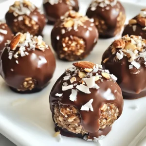 To make your Almond Joy Energy Balls, you'll need these simple ingredients: - 1 cup rolled oats - 1/2 cup almond butter - 1/3 cup honey or maple syrup - 1/2 cup unsweetened shredded coconut - 1/2 cup dark chocolate chips - 1/4 cup chopped almonds - 1 teaspoon vanilla extract - Pinch of salt Each ingredient plays an important role. Rolled oats give a hearty texture. Almond butter adds creaminess and protein. Honey or maple syrup brings sweetness and binds the mix. Unsweetened shredded coconut gives that classic coconut flavor. Dark chocolate chips add a rich, sweet touch. Chopped almonds add crunch and extra nutrients. Vanilla extract lifts all the flavors, while a pinch of salt enhances sweetness. These ingredients work together to create a perfect blend of flavors and textures. You can enjoy these energy balls as a snack or treat. They are easy to prepare and full of goodness. Plus, they are a fun way to boost your energy! {{ingredient_image_2}} 1. In a large bowl, combine 1 cup rolled oats, 1/2 cup almond butter, and 1/3 cup honey or maple syrup. Stir well with a spatula until smooth. 2. Next, add 1/2 cup unsweetened shredded coconut, 1/2 cup dark chocolate chips, 1/4 cup chopped almonds, 1 teaspoon vanilla extract, and a pinch of salt. 3. Use your hands to blend everything together. Make sure all ingredients are mixed well. This helps the energy balls hold together. 1. Cover the bowl with plastic wrap. Place it in the fridge for 15 to 30 minutes. Chilling makes the mixture firm and easier to roll. 1. After chilling, scoop out portions with a tablespoon. Roll each portion into a ball using your hands. Aim for about 12 to 15 energy balls, depending on the size. 1. Place the rolled energy balls on a parchment-lined baking sheet. Put them back in the fridge for another 30 minutes. This final chill helps them set firmly, making them perfect for snacking. To keep your Almond Joy Energy Balls fresh, store them in the fridge. They taste best cold. Use an airtight container to prevent them from drying out. You can also freeze them for longer storage. Just place them in a freezer-safe bag. They will last about three months in the freezer. When serving, presentation matters. Arrange the energy balls on a colorful plate. You can add some shredded coconut on top for a nice touch. These energy balls make a great snack for kids and adults. They are perfect for parties or lunch boxes. If you want a vegan option, use maple syrup instead of honey. For nut allergies, you can swap almond butter for sunflower seed butter. Dark chocolate chips can be replaced with dairy-free chocolate or carob chips. These swaps keep the energy balls tasty and safe for everyone. Pro Tips Chill for Better Texture: Allow the mixture to chill long enough before rolling. This helps the energy balls hold their shape better and makes them easier to handle. Customize Your Mix-ins: Feel free to substitute the chopped almonds with other nuts or seeds like walnuts or sunflower seeds for a unique flavor twist. Use Natural Sweeteners: For a healthier option, experiment with natural sweeteners like agave syrup or brown rice syrup in place of honey or maple syrup. Storage Tips: Store the energy balls in an airtight container in the refrigerator for up to a week, or freeze them for longer shelf life. {{image_4}} Oats are a great choice for energy balls. They provide fiber, which helps with digestion. Eating oats can keep you full and satisfied. This helps avoid unhealthy snacks later. Almonds bring healthy fats and protein. They also offer vitamin E, which is good for your skin. Dark chocolate adds a delicious touch and contains antioxidants. These help protect your body from damage. Each serving of Almond Joy Energy Balls has about 150 calories. This comes from the oats, almond butter, honey or maple syrup, and chocolate. Here's a quick breakdown: - Rolled Oats: 30 calories - Almond Butter: 95 calories - Honey or Maple Syrup: 20 calories - Dark Chocolate Chips: 30 calories - Chopped Almonds: 15 calories With these energy balls, you get a tasty treat that fuels your day. Plus, they are easy to make and enjoy! You can easily change the taste of your energy balls. One way is to add spices. A sprinkle of cinnamon gives a warm flavor. Cocoa powder adds a rich chocolate kick. You can also try different nut butters. If you want a twist, use peanut butter or cashew butter. Each nut butter brings its unique taste and texture. This makes your energy balls even more fun! You can mix in extra ingredients for more flavor and nutrition. Dried fruits, like raisins or cranberries, add sweetness and chewiness. Seeds like chia or flaxseed boost the health benefits. They also add a nice crunch. Feel free to get creative! Use what you have at home. The more you experiment, the more exciting your energy balls will be. Almond Joy Energy Balls last about one week in the fridge. Store them in an airtight container. This keeps them fresh and tasty. If you want them to last longer, freeze them. They can stay good in the freezer for up to three months. Yes, you can freeze the energy balls. To freeze, place them in a single layer on a baking sheet. Once frozen, transfer them to a freezer-safe bag or container. When you want to eat them, take out a few and let them thaw in the fridge. They will be ready to enjoy in a couple of hours. If you don't have almond butter, use peanut butter or sunflower seed butter. Both work well and provide a similar creamy texture. You can also try cashew butter for a different flavor. These options keep your energy balls delicious. Yes, these energy balls are great for kids. They are sweet and fun to eat. The oats and nuts provide energy for play. Plus, kids can help make them. Rolling the balls is a fun activity that they will enjoy. You now have a simple guide to make Almond Joy Energy Balls. We covered ingredients, steps, and added tips for variations and storage. These energy balls are tasty and healthy, packed with oats, nuts, and chocolate. They are great for kids and adults alike. Enjoy these snacks on the go or after workouts. Experiment with flavors and keep them fresh in your fridge. Making nutritious treats can be fun and easy!