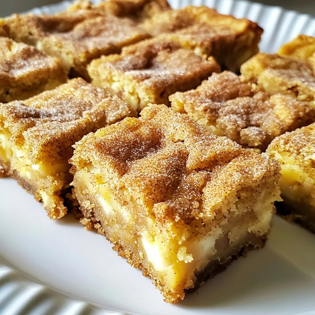 To make these tasty Snickerdoodle Blondies, gather the following ingredients: - 1 cup unsalted butter, melted - 1 cup packed brown sugar - 1/2 cup granulated sugar - 2 large eggs, at room temperature - 2 teaspoons pure vanilla extract - 2 cups all-purpose flour - 1 teaspoon baking powder - 1/2 teaspoon fine sea salt - 1 tablespoon ground cinnamon - 1/2 cup white chocolate chips (optional for added creaminess) You can enhance your blondies with these optional ingredients: - 1/2 cup chopped nuts (like pecans or walnuts) for crunch - 1/2 teaspoon almond extract for a nutty essence - A pinch of nutmeg for warmth If you need to swap out ingredients, here are some great options: - Use coconut oil instead of butter for a dairy-free version. - Swap all-purpose flour for gluten-free flour if needed. - Use light brown sugar instead of dark brown sugar for a milder taste. These simple swaps help keep your blondies tasty while meeting dietary needs or preferences. Enjoy experimenting! {{ingredient_image_2}} Start by preheating your oven to 350°F (175°C). Grease a 9x13 inch baking pan with non-stick spray. You can also line it with parchment paper. This helps with easy removal later. In a large mixing bowl, pour in 1 cup of melted butter. Then, add 1 cup of packed brown sugar and 1/2 cup of granulated sugar. Use a whisk or hand mixer to blend until smooth and combined. Crack 2 large eggs into the bowl, one at a time. Beat well after each egg to mix them in fully. Next, stir in 2 teaspoons of pure vanilla extract. Mix until everything is well combined. In a separate bowl, whisk together 2 cups of all-purpose flour, 1 teaspoon of baking powder, 1/2 teaspoon of fine sea salt, and 1 tablespoon of ground cinnamon. This step ensures the baking powder and spices spread evenly. Gradually add the dry ingredients to the wet mixture. Stir gently until just combined. Do not overmix. If you want white chocolate chips, fold in 1/2 cup gently at this stage. Pour the blondie batter into your prepared baking pan. Use a spatula to spread it evenly. Bake for 20 to 25 minutes. The blondies are done when a toothpick comes out with a few moist crumbs. After baking, let them cool in the pan for at least 10 minutes. Then, transfer to a wire rack to cool completely. To get the best texture for your Snickerdoodle Blondies, follow these key tips: - Melted Butter: Use melted butter for a chewy texture. - Room Temperature Eggs: Ensure your eggs are at room temperature. This helps mix well. - Don't Overmix: Stir just until combined to keep them soft and tender. Overmixing makes them dense. Here are common mistakes to watch out for: - Too Much Flour: Measure flour carefully. Too much makes them dry. - Skipping the Cooling Step: Allowing them to cool helps firm them up. - Not Testing for Doneness: Use a toothpick. It should have a few moist crumbs, not wet batter. You can make your blondies even better with these ideas: - Cinnamon Sugar: Sprinkle a mix of cinnamon and sugar on top after baking. - White Chocolate Chips: Add half a cup for extra creaminess. - Chopped Nuts: Mix in walnuts or pecans for a crunchy bite. Enjoy these tips to make your Snickerdoodle Blondies truly delightful! Pro Tips Use Room Temperature Ingredients: Ensuring your eggs are at room temperature helps to create a smoother batter, leading to a better texture in the final blondies. Don't Overmix: Mixing the batter just until combined will help keep your blondies soft and chewy, rather than dense and tough. Cool Completely: Allowing the blondies to cool completely before cutting will result in cleaner slices and a firmer texture, making them easier to handle. Experiment with Add-Ins: Feel free to customize your blondies by adding nuts, dried fruit, or even a swirl of peanut butter for a unique twist on this classic recipe. {{image_4}} You can mix it up by adding different chocolate chips. Try semi-sweet or dark chocolate chips. They add a rich flavor that pairs well with the cinnamon. If you want a fun twist, use peanut butter chips, too. Each option adds its unique taste to the blondies. Nuts can add a great crunch to your blondies. Chopped walnuts or pecans work well in this recipe. They give a nice texture and flavor contrast. You can also toast the nuts to enhance their taste. Just fold in a half cup of your choice when mixing the batter. If you need a gluten-free option, swap the all-purpose flour for a gluten-free blend. Many brands offer mixes that work well in baking. Just make sure to check that they have xanthan gum for better texture. This way, everyone can enjoy your snickerdoodle blondies! To keep your snickerdoodle blondies fresh, store them in an airtight container. This will prevent them from drying out. If you use parchment paper, it helps them stay soft. You can layer the blondies with parchment to avoid sticking. Keep them in a cool, dry place away from sunlight. If you want to save some for later, freezing works well. First, cut the blondies into squares. Wrap each piece tightly in plastic wrap. Then, put them in a freezer-safe bag or container. Make sure to remove as much air as you can. They can last up to three months in the freezer. When you are ready to eat them, let them thaw in the fridge overnight. For the best taste, eat the blondies within one week. They stay soft and tasty when stored properly. If frozen, enjoy them within three months for the best flavor. After that, they may lose some of their yummy taste and texture. Snickerdoodle blondies are soft, sweet bars that mix flavors of snickerdoodles and blondies. They are rich and chewy, made with butter, sugar, and cinnamon. These treats often include white chocolate chips for extra creaminess. The combination creates a delightful dessert that is easy to enjoy. Yes, you can make snickerdoodle blondies ahead of time! They store well, so you can bake them a day or two in advance. Just make sure to keep them in an airtight container. This helps them stay fresh and moist until you are ready to serve. To check if your blondies are done, use a toothpick. Insert it into the center of the blondies. If it comes out with a few moist crumbs, they are ready. If you see wet batter on the toothpick, bake them a few more minutes. You can use only brown sugar, but it will change the texture. Blondies made with only brown sugar will be denser and chewier. Mixing brown sugar with granulated sugar gives a lighter texture and sweet flavor. Snickerdoodle blondies are great on their own, but you can serve them warm with ice cream. A scoop of vanilla or cinnamon ice cream pairs nicely. You can also sprinkle more cinnamon sugar on top for added flavor. You’ve learned how to make Snickerdoodle Blondies that are soft and tasty. We covered the key ingredients, mixing techniques, and baking steps. You now know tips to avoid mistakes and how to add your own twist. Remember, these blondies can also be stored or frozen for later. Enjoy the delight of making and sharing them. Happy baking!