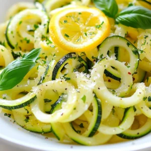 - 4 medium zucchinis, spiralized into noodles - 3 tablespoons extra virgin olive oil - 4 cloves fresh garlic, minced - 1 teaspoon red pepper flakes - Zest of 1 medium lemon - Juice of 1 medium lemon - &frac14; cup finely grated Parmesan cheese (optional) - Salt and freshly ground black pepper - Fresh basil leaves for garnish Use medium zucchinis for the best texture. Each zucchini should give you about one cup of noodles. The olive oil adds flavor and helps cook the garlic without burning it. Fresh garlic gives a bright taste. You can adjust the red pepper flakes based on your spice level. Add grilled chicken or shrimp for protein. You can also swap the Parmesan cheese for nutritional yeast for a vegan touch. Try adding fresh herbs like parsley or oregano for extra flavor. Consider throwing in cherry tomatoes for a sweet burst. {{ingredient_image_2}} Start by spiralizing four medium zucchinis into noodles. You can use a spiralizer or a julienne peeler. Once you have your noodles, set them aside. Make sure they are a bit dry. Too much moisture can make the dish watery. Next, grab a large skillet. Pour in three tablespoons of extra virgin olive oil. Heat it over medium heat until it shimmers. Add four minced garlic cloves and one teaspoon of red pepper flakes. Stir often for one to two minutes. You want the garlic to smell good and turn lightly golden. Watch it closely! Burned garlic can taste bitter. Now it&rsquo;s time for the zucchini noodles. Turn the heat to medium-high and add the noodles to the skillet. Saut&eacute; them for about three to four minutes. Toss them often. You want them to be tender but still have a little crunch, like al dente pasta. Once they&rsquo;re cooked, remove the skillet from the heat. Add the zest and juice of one lemon. Stir gently to mix the flavors. You can also add a quarter cup of finely grated Parmesan cheese if you like. It adds a nice creamy touch. Season with salt and black pepper to taste. Finally, serve hot and garnish with fresh basil leaves for color and flavor. Enjoy! To make perfect zucchini noodles, choose firm zucchinis. Look for ones that are medium-sized. Use a spiralizer for best results. If you don&rsquo;t have one, a julienne peeler works too. Just keep the zucchini steady while you twist. This ensures even noodles. Aim for thin, long strands that resemble pasta. Zucchini has a lot of water. If you don&rsquo;t dry your noodles, the dish may become soggy. After spiralizing, let them sit in a colander for a few minutes. You can sprinkle a bit of salt on them to draw out more moisture. Pat them dry with a paper towel before cooking. This simple step keeps your noodles crisp and delicious. For spice lovers, add more red pepper flakes. Start with one teaspoon and taste as you go. If you prefer milder flavors, use less. You can also skip the flakes entirely if you want a gentle taste. Remember, you can always add spice, but you can&rsquo;t take it away. Adjust to suit your taste buds! Pro Tips Dry Zucchini Noodles: Make sure to pat the spiralized zucchini noodles dry with a paper towel to reduce excess moisture, which can make the dish watery. Control the Heat: Keep the heat at medium-high while saut&eacute;ing the noodles to ensure they cook evenly without becoming mushy. Fresh Ingredients: For the best flavor, use fresh garlic and freshly squeezed lemon juice. It makes a noticeable difference in taste. Garnish with Purpose: Fresh basil not only adds color but also enhances the overall flavor profile of the dish. Don't skip this step! {{image_4}} You can easily add proteins to your Lemon Garlic Zucchini Noodles. Chicken, shrimp, or tofu work well. Cook the protein first, then add it to the noodles at the end. This method keeps the protein juicy and flavorful. If you want to keep it simple, grilled chicken pairs nicely with the lemon and garlic. To make this dish vegan, skip the Parmesan cheese. You can replace it with nutritional yeast for a cheesy taste. If you want extra creaminess, add a splash of coconut milk. This keeps the dish rich and satisfying without any dairy. Fresh herbs like cilantro or parsley can also add a nice touch. You can boost the flavor with herbs and spices. Fresh basil is great, but try adding thyme or oregano for a different taste. If you like heat, consider more red pepper flakes or a dash of cayenne pepper. A squeeze of lime juice can also add a fresh twist. Each variation makes the dish unique and fun to explore. To keep your leftover lemon garlic zucchini noodles fresh, place them in an airtight container. Make sure to cool the noodles to room temperature before sealing. Store them in the fridge for up to three days. This helps keep their flavor and texture. Reheat the zucchini noodles in a skillet over medium heat. Add a splash of olive oil to prevent sticking. Heat for about 2-3 minutes, stirring gently. This warms them through while keeping their crunch. You can also use the microwave. Place them in a microwave-safe dish, cover loosely, and heat for 1-2 minutes. Stir halfway for even heating. Freezing zucchini noodles is possible but may change their texture. If you want to freeze them, blanch the noodles first. Boil them for just 1-2 minutes, then plunge them in ice water. Drain and pat dry before placing them in a freezer bag. They can last up to two months in the freezer. To thaw, place them in the fridge overnight or microwave for a few minutes. Yes, you can use pre-packaged zucchini noodles. They save time and effort. Just check the package for freshness. If they feel wet, pat them dry with a paper towel before cooking. This helps keep your dish light and crisp. To keep zucchini noodles from getting soggy, use these tips: - Spiralize and dry: After spiralizing, let the noodles sit. This helps remove excess water. - Cook quickly: Saut&eacute; the noodles on high heat. This method helps them stay firm. - Don&rsquo;t overcrowd: Cook in batches if needed. Too many noodles at once can trap steam. Absolutely! This dish is naturally gluten-free. The zucchini noodles replace traditional pasta. Just check any added ingredients, like Parmesan cheese, to make sure they fit your dietary needs. Enjoy this light, tasty meal without gluten worries! Zucchini noodles offer a fresh twist to your meals. We covered key ingredients, step-by-step prep, and handy tips. You can customize your dish with proteins and spices. Storing leftovers is simple, and reheating is easy. By knowing the answers to common questions, you can make the best dish. Enjoy making zucchini noodles your way for tasty, healthy meals.